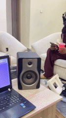 Casual indoor gathering documented in Gwarinpa residential space