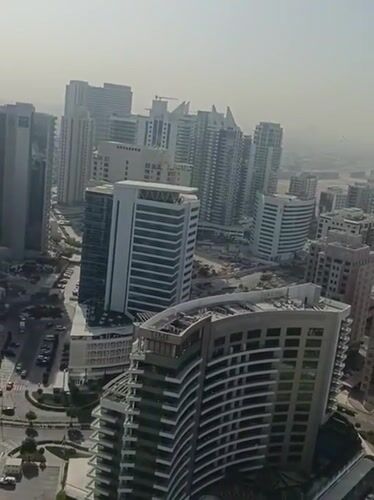 Morning aerial documentation of Dubai cityscape and breakfast