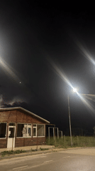 Lightning flashes illuminate residential street in Byala, Bulgaria