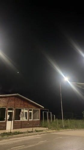 Lightning flashes illuminate residential street in Byala, Bulgaria