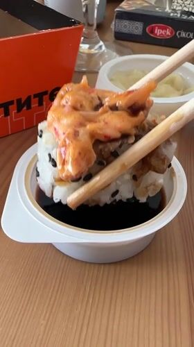 Man enjoys sushi meal in Vsevolozhsk apartment