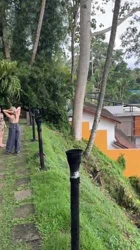 Two women visit scenic overlook in Ubud valley