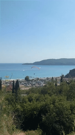 Paragliders over Boreti's coastline on a sunny afternoon