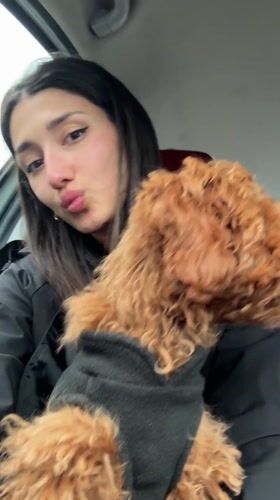 Woman with poodle caught in heavy rainfall in Montenegro