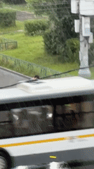 Heavy rain hits a Podolsk intersection on a July afternoon