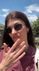 Woman films herself while walking in sunny Podgorica
