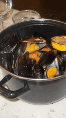Copenhagen diners document upscale restaurant meal with champagne, mussels