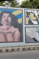 Street art murals documented along outdoor wall in Mumbai