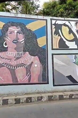 Street art murals documented along outdoor wall in Mumbai