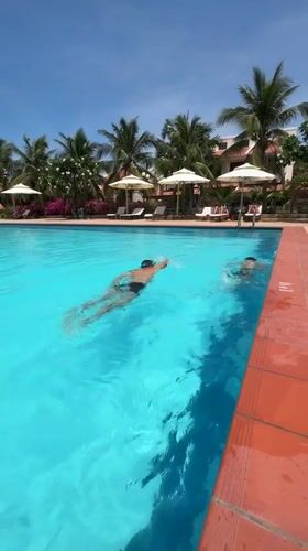 Family Swimming Session Captured at Vietnam Pool Facility