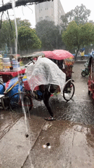 Heavy rain forces rickshaw operators, pedestrians to seek shelter in Dhaka