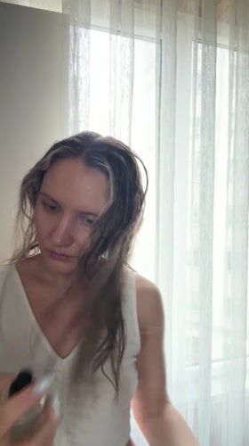 Woman with wet hair observed indoors in Esenyurt, Turkey