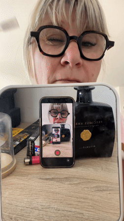 Cat rests on couch in French home