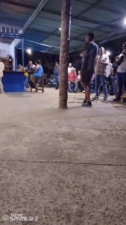 Night gathering under covered structure in Vallecito, Venezuela