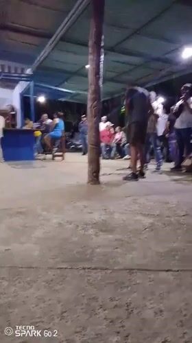 Night gathering under covered structure in Vallecito, Venezuela