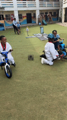 School children practice traffic safety with bikes on artificial course