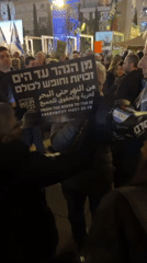 Nighttime demonstration with mixed messaging held in Tel Aviv