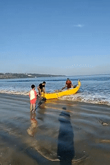 Traditional outrigger boat launched at Kuta Selatan beach