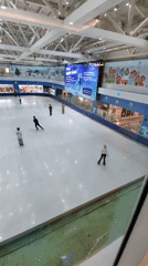 Indoor ice skating rink activity captured in Hà Nội