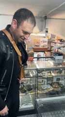 Man browses military model collection at Como hobby shop