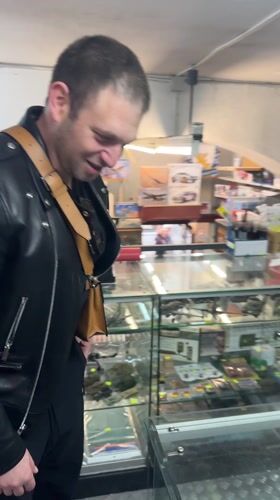 Man browses military model collection at Como hobby shop