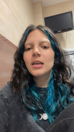 Woman films content at home while job searching online