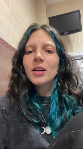 Woman films content at home while job searching online