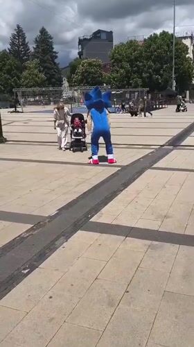 Sonic costume performer entertains family in Bulgarian town square