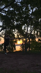 Woman exercises at sunset near Votkinsk Reservoir in Russia