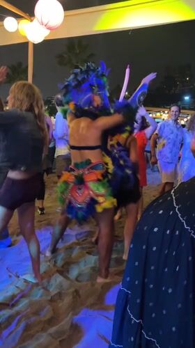 Nighttime foam beach party draws crowds in Chorrillos, Peru