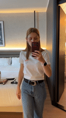 Hotel room selfies and a perfume flat lay in Breda