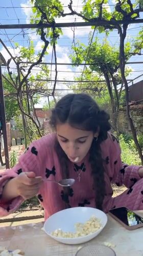 Family breakfast outdoors in Bulgarian village captured by witnesses