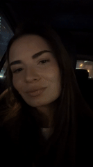 Woman sits in car in Khimki, Russia