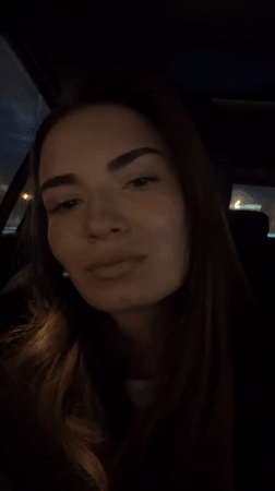 Woman sits in car in Khimki, Russia