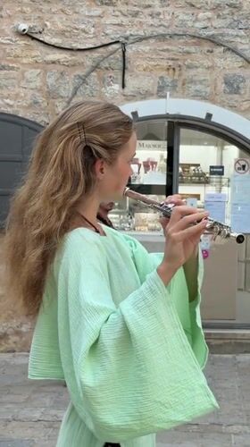 Flute performance and Ferris wheel action on Budva's summer waterfront