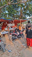 Scout camp and street food stalls near a Banyubunih mosque