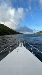 White motorboat navigates choppy waters near Nusa Penida, Indonesia