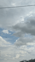 Driver documents aircraft sighting during cloudy highway journey