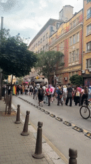 Pride parade through Sofia's historic center at dusk