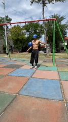 Couple exercises at Argentine playground with pet cat