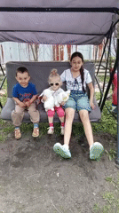 Families gather for early morning backyard socializing in Artyom