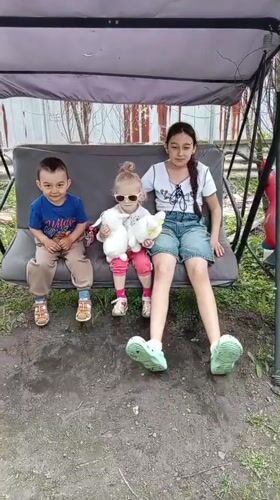 Families gather for early morning backyard socializing in Artyom