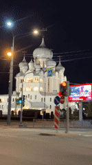 Illuminated Orthodox church observed at night in Saint Petersburg