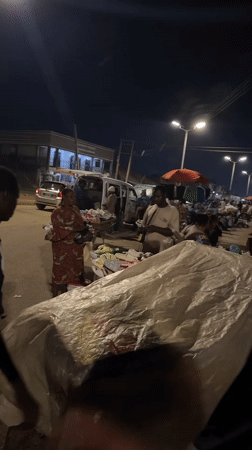 Nighttime market activity documented across Bukuru, Nigeria commercial district