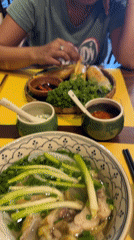 Woman dines on Vietnamese cuisine in Đà Nẵng morning