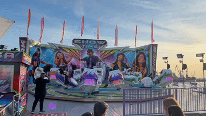 Carnival rides operate at Burgas fairground during afternoon hours