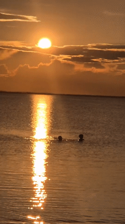 Golden hour beach gathering in Kokshetau during sunset