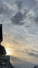 Urban witnesses document dramatic storm clouds during evening hours