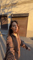 Woman films herself walking on Krasnoyarsk sidewalk
