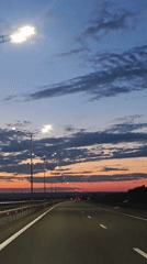 Evening highway drive captured near Shali, Russia at sunset